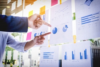 Businessman making Presentation with his Colleagues